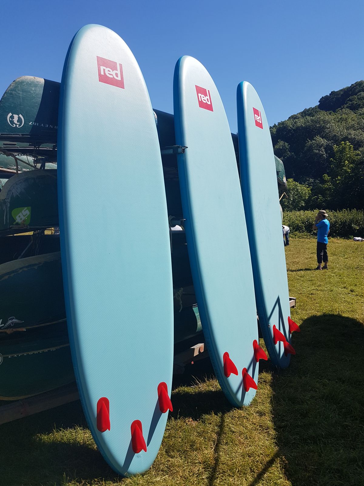 Red Paddle Boards in the sun ready to go