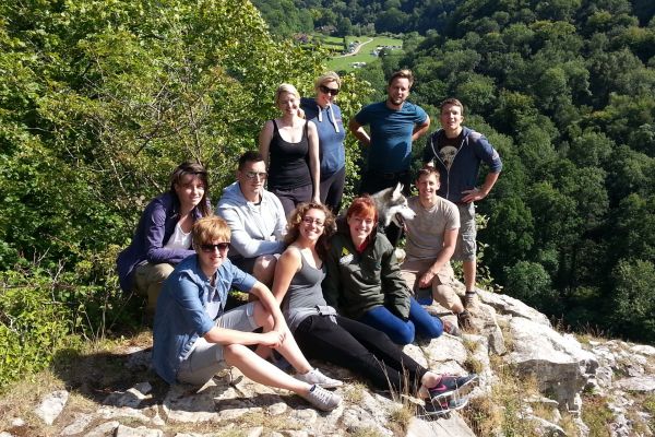 A group sat on Seven Sisters Rocks on a guided walk